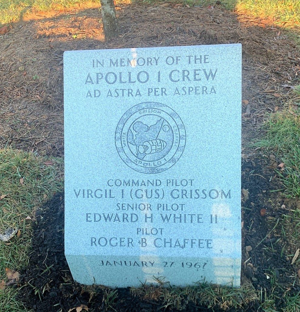 Granite marker in memory of the Apollo 1 crew, inscribed Ad Astra Per Aspera, naming Grissom, White and Chaffee