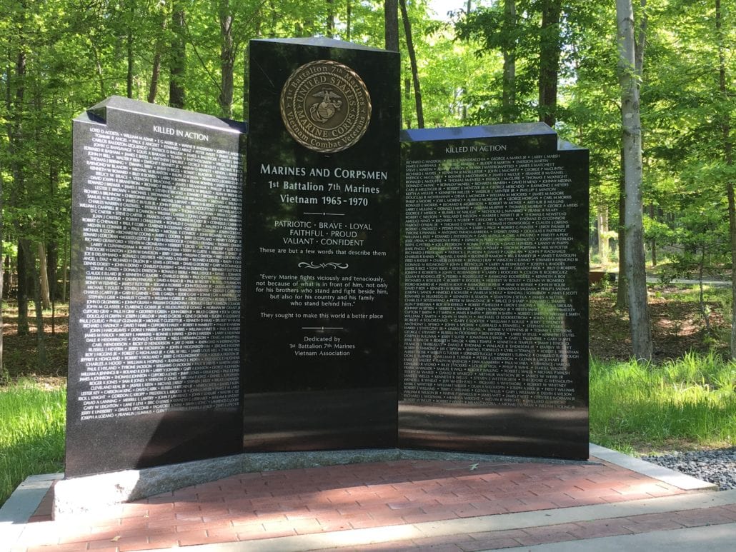 Black granite memorial to the Marines and Corpsmen of the 1st Battalion 7th Marines, Vietnam 1965 to 1970, with panels of names