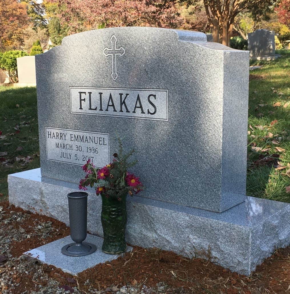 Granite memorial lettered for the Fliakas family, installed in a cemetery