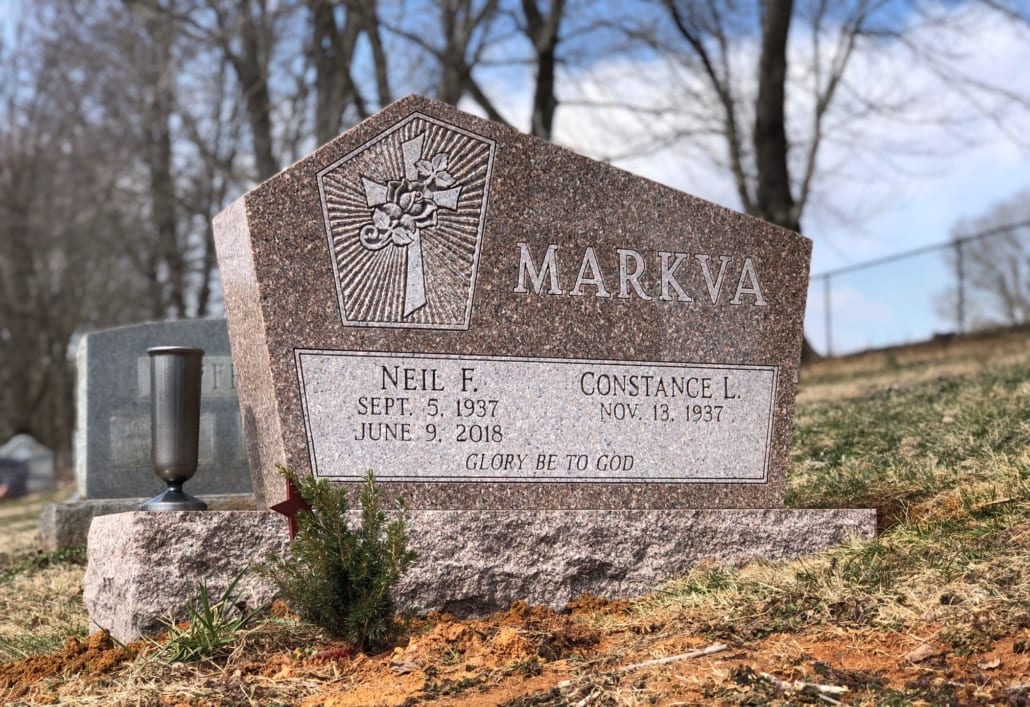 The Markva memorial, a wide granite monument installed in a cemetery