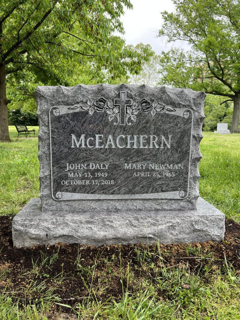 Granite memorial lettered for the McEachern family, installed in a cemetery