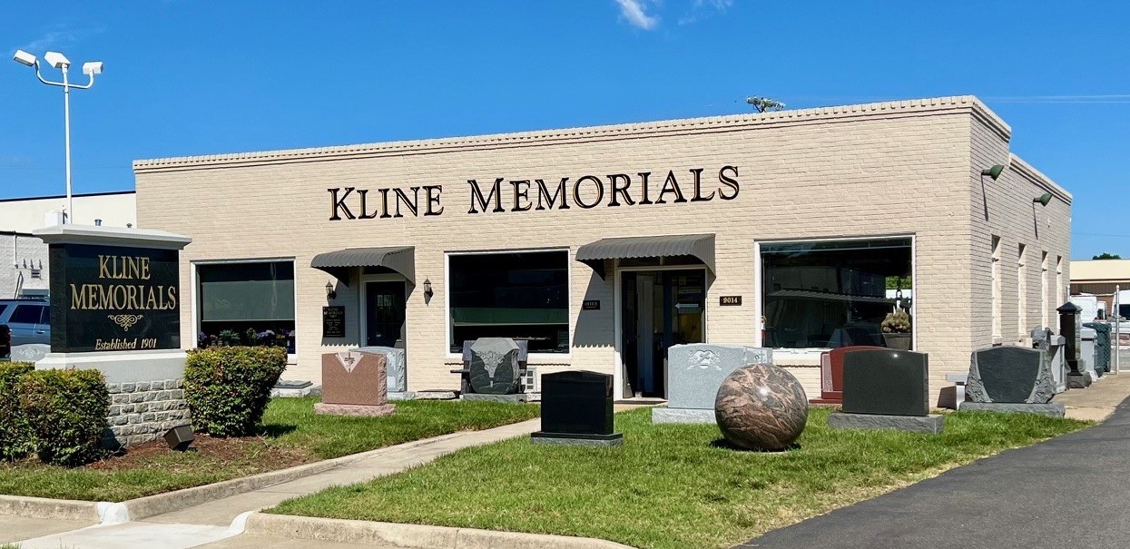 The Kline Memorials building on Centreville Road today, with a roadside sign reading Kline Memorials Established 1901 and granite monuments on the lawn